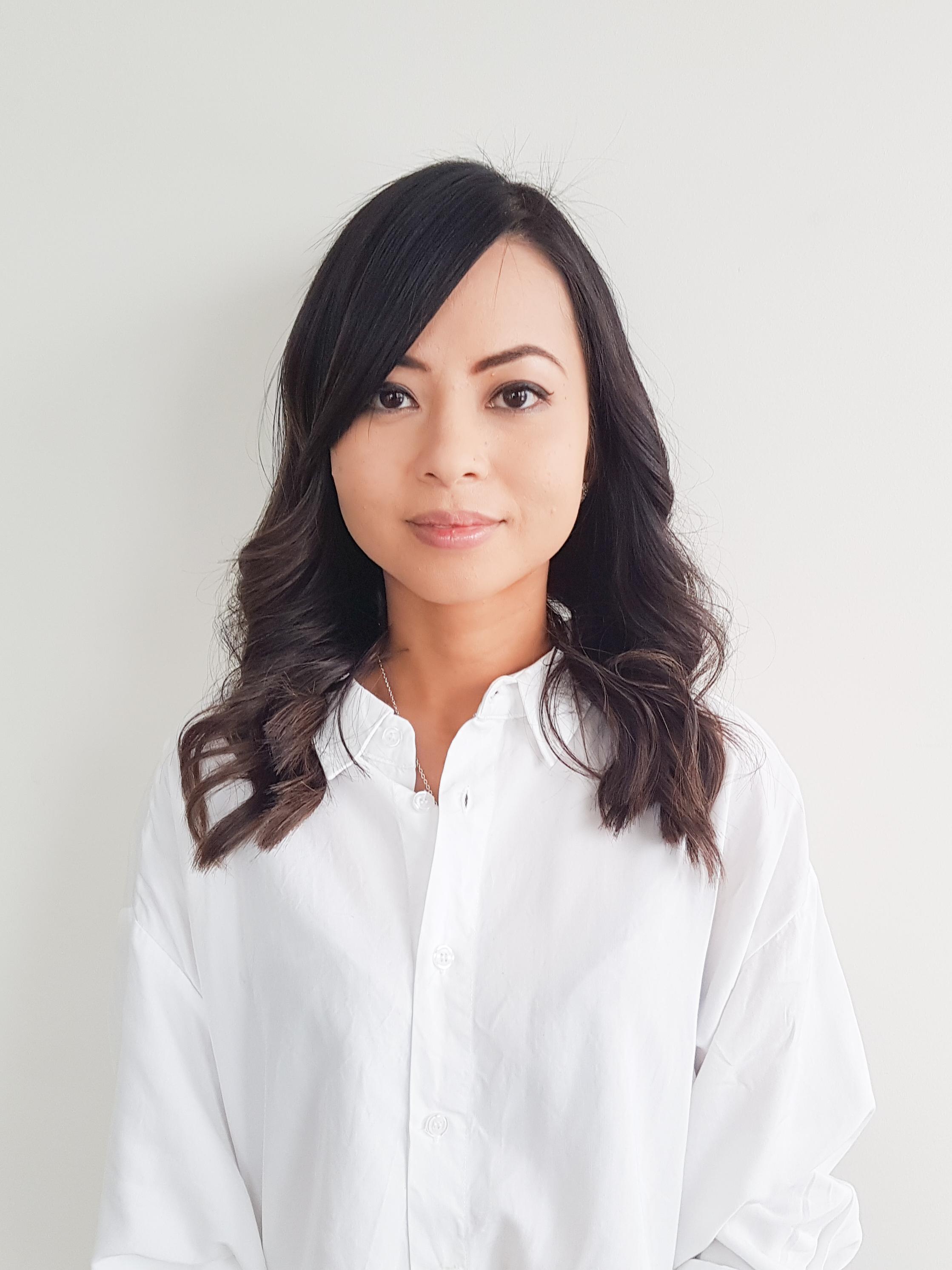 Woman in white shirt in front of white background