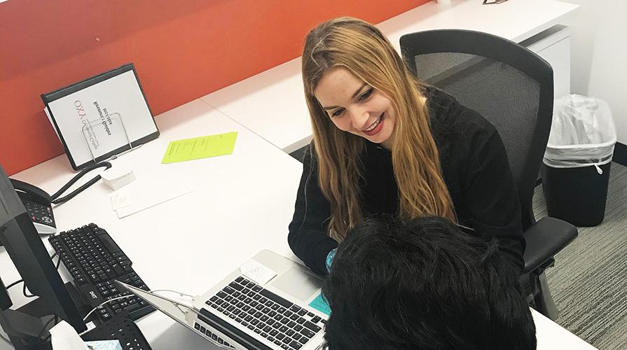 Nina Srdić Hadži-Nešić helps a student in the career center.