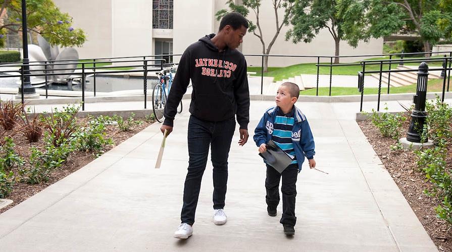 An Oxy student and a young child