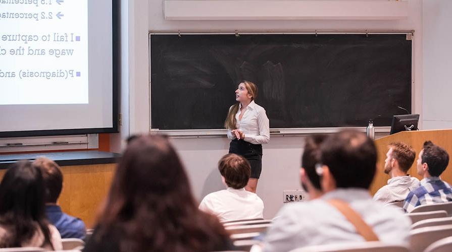 Economics student presenting her research