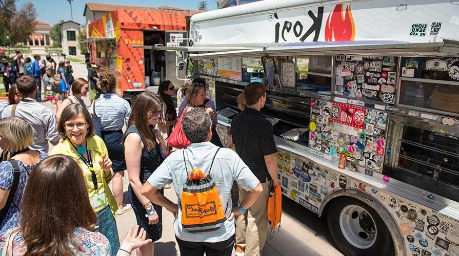 People crowded outside a food truck