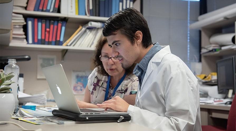 Student in a lab with a mentor