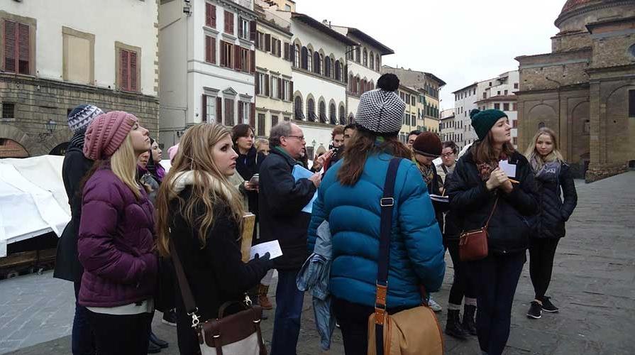 A class of Oxy students abroad look at surrounding architecture