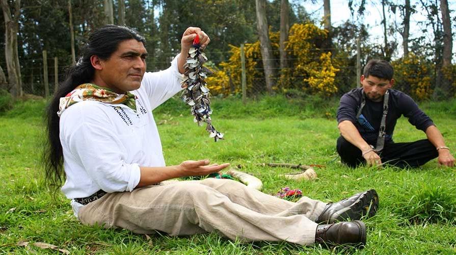 A man displays craftwork in Latin America