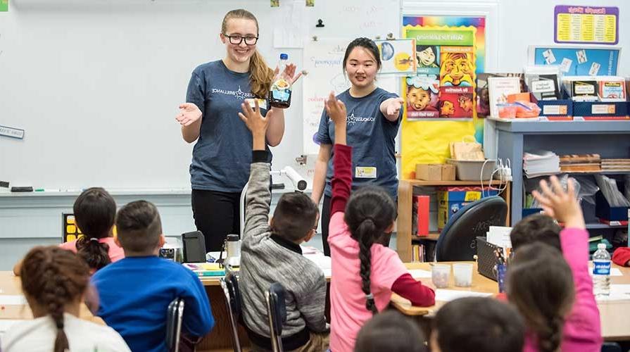 Oxy students volunteering in elementary school classrooms