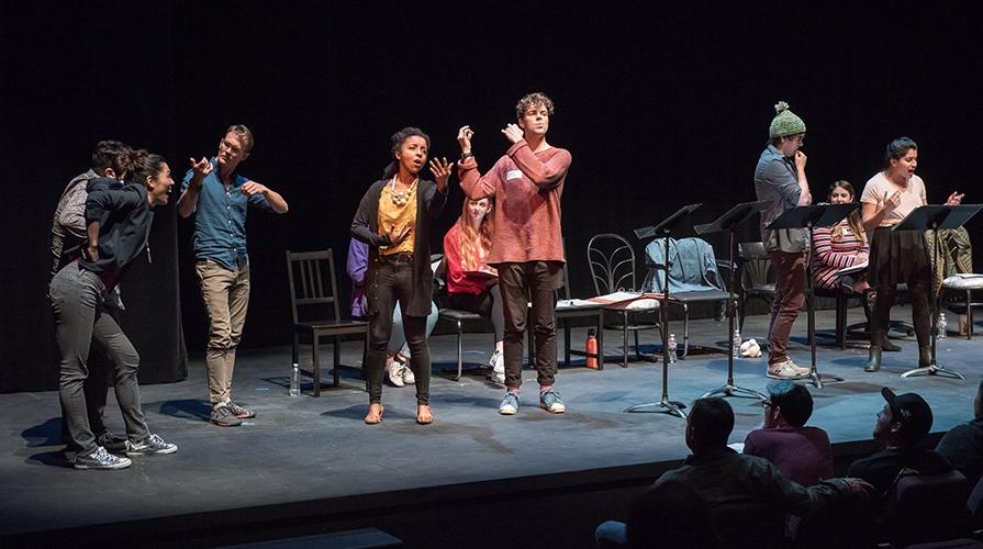 Students perform on stage at the New Play Festival