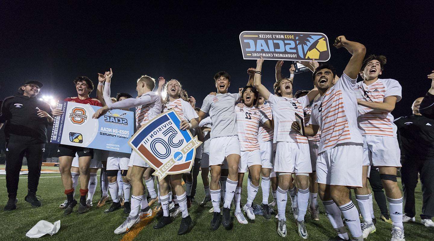 Oxy's men's soccer team celebrating on the field