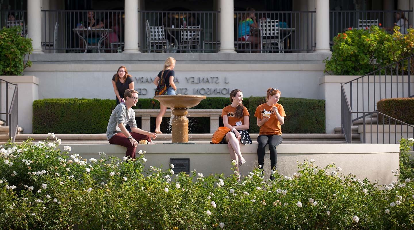 Students relax in front of Johnson Student Center