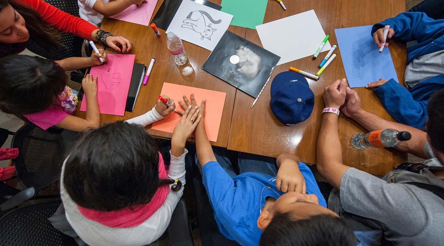 The California Immigration Semester (CIS) and Center for Community Based Learning (CCBL) hosts a group of local elementary school students as part of a "Day at College" event. 