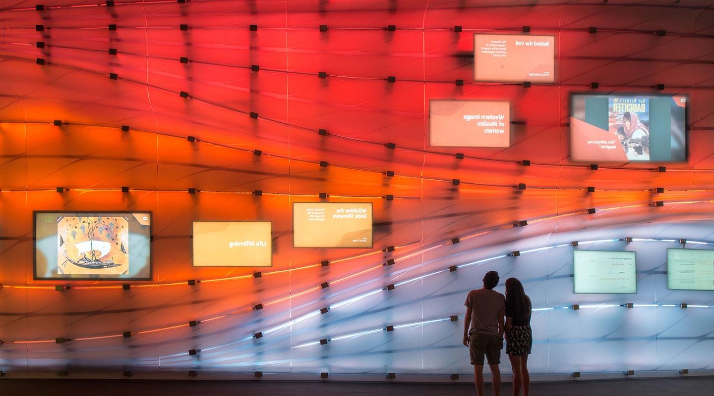 Students watch a Global Crossroads presentation on the McKinnon Center media wall