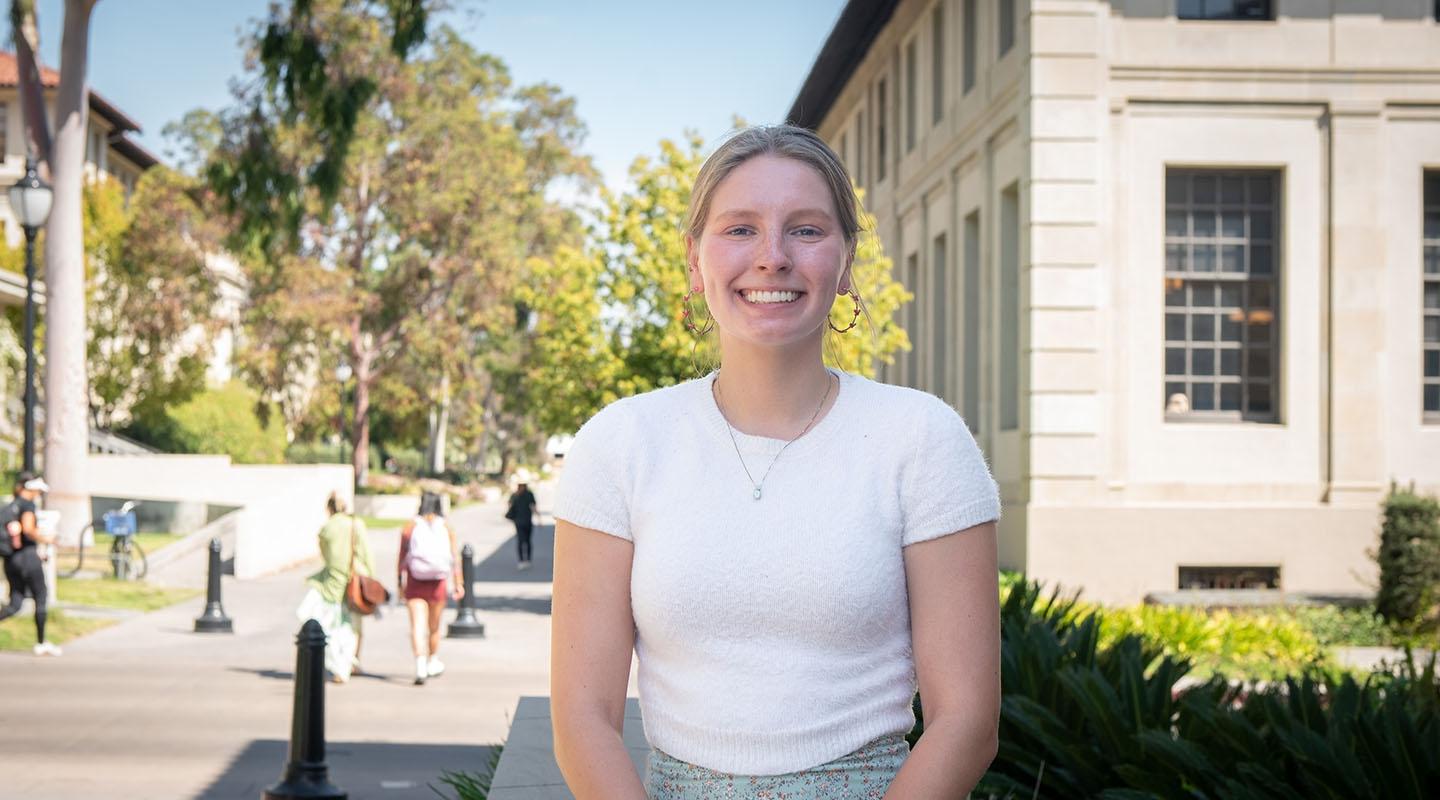 Amelia Muscott in front of the library