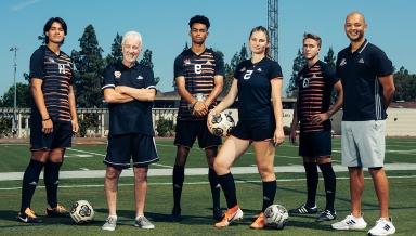 Oxy soccer players posing on field