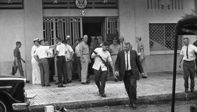 Deputy Ambassador U. Alexis Johnson ’31, left, evacuates the U.S. Embassy in Saigon on March 31, 1965.