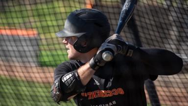 An Oxy baseball player takes batting practice on January 27, 2022.