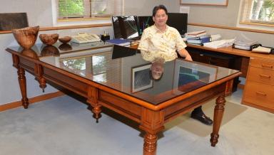 David Louie '73 behind the desk of the attorney general in Hawai'i.