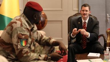 Michael Gonzales '96 with Guinean Transition President Mamady Doumbouya.