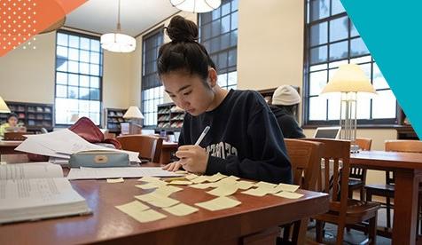 student in library