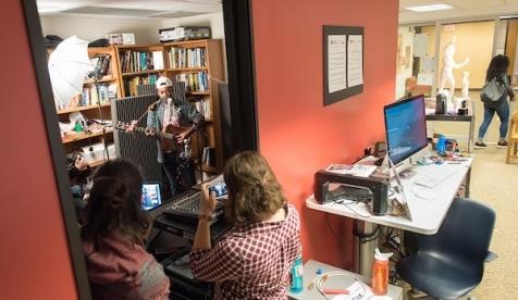 Students watch musicians performing in the Critical Making Studio