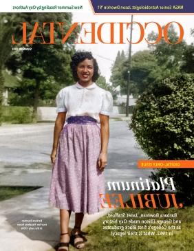 a young Black woman from the 1950s poses on campus