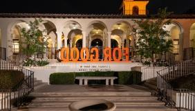 A shot of the Johnson Student Center south entrance with a fountain and the 3-D letters For Good assembled