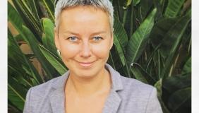 Dr. Katie Zyuzin in front of plants