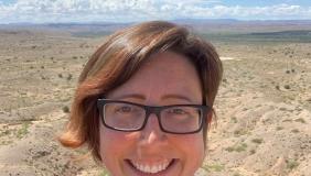 Dr. Kate Boersma in front of desert landscape