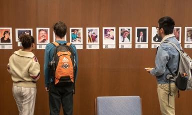 Students looking at an interactive exhibit in the Oxy library