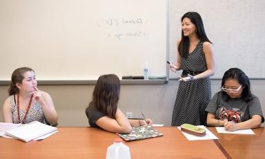 Professor Jane Hong teaches three students in a classroom