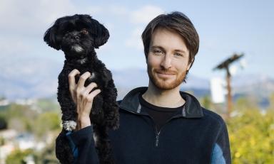 Zak Stoltz '10 with his dog, Boba, at his home in Mount Washington.