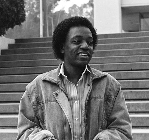 Saint-Aubin on the steps next to Johnson Hall in a 1986 photo.