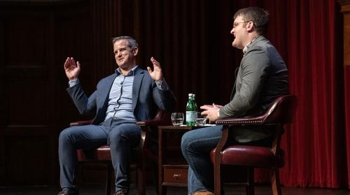 Prof. Isaac Hale and Adam Kinzinger talk on stage at Thorne Hall